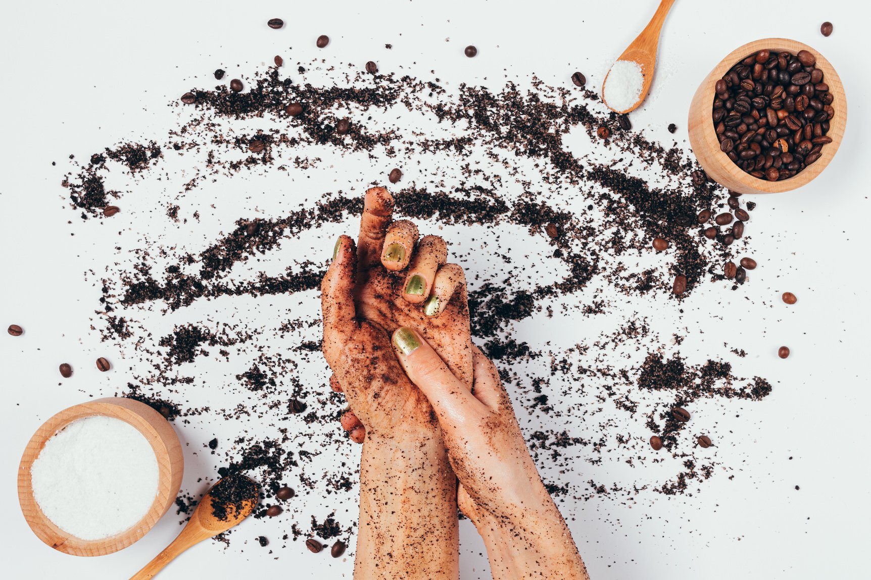 Woman Applying Coffee Scrub on Hands Flatlay